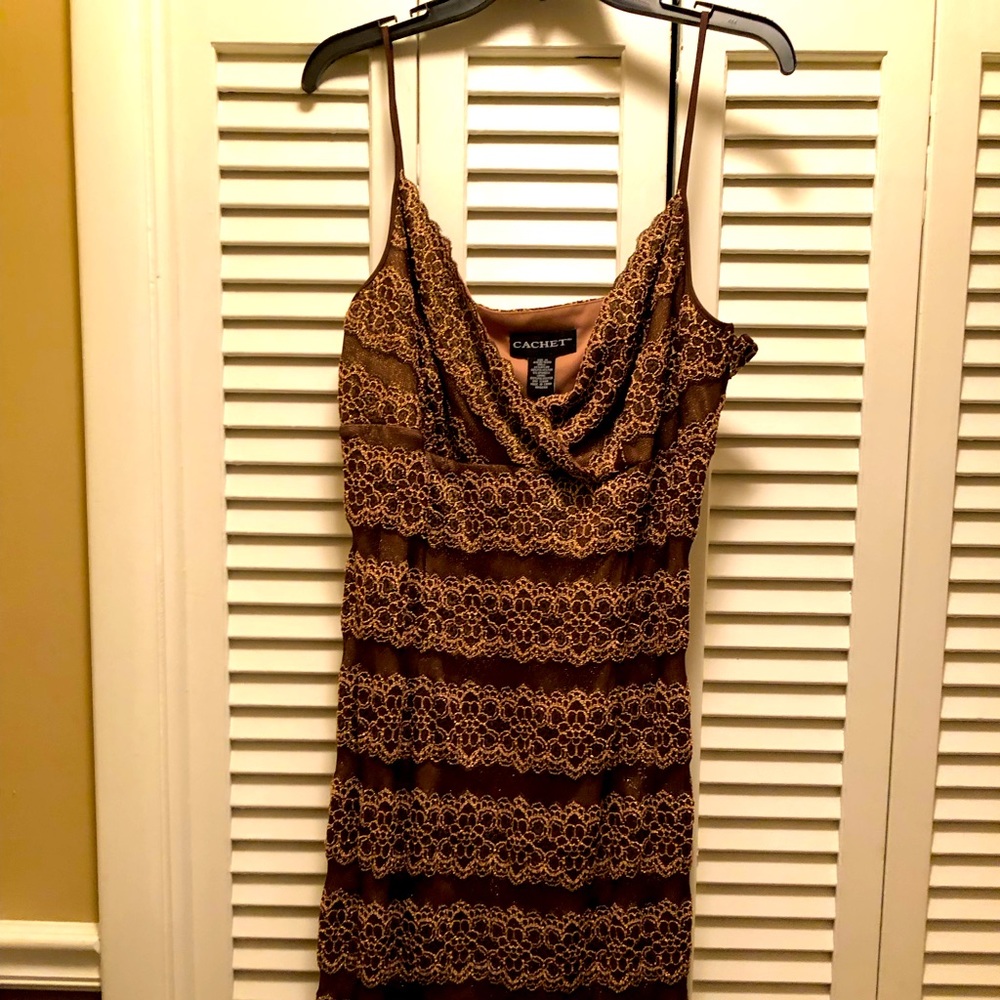 Elegant and fun spaghetti strap cocktail dress hits just above knee in bronze